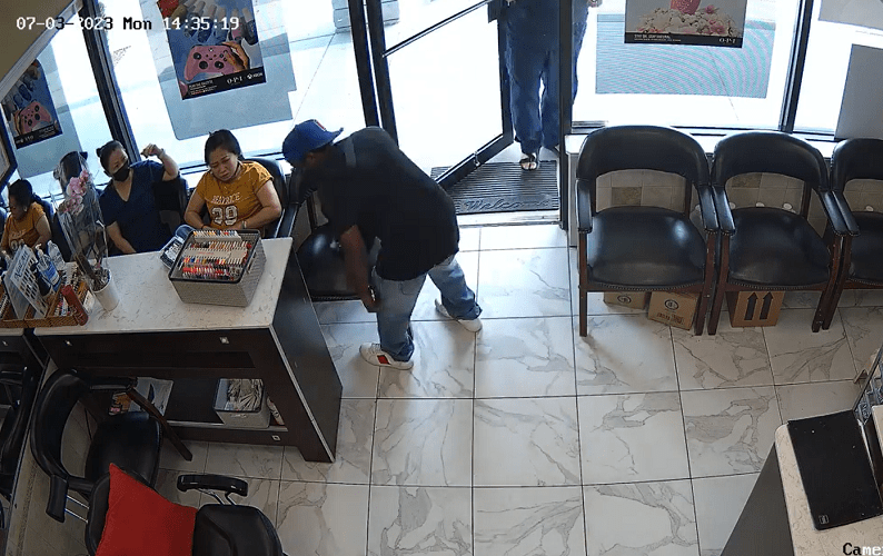 Hilarious video shows a man try to rob an Atlanta nail salon. No one cared.