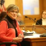 Laura Kelly signs workers compensation bill for Kansas, after labor and business negotiate