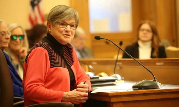 Laura Kelly signs workers compensation bill for Kansas, after labor and business negotiate