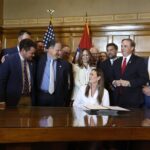 Arkansas governor signs income, property tax cuts into law
